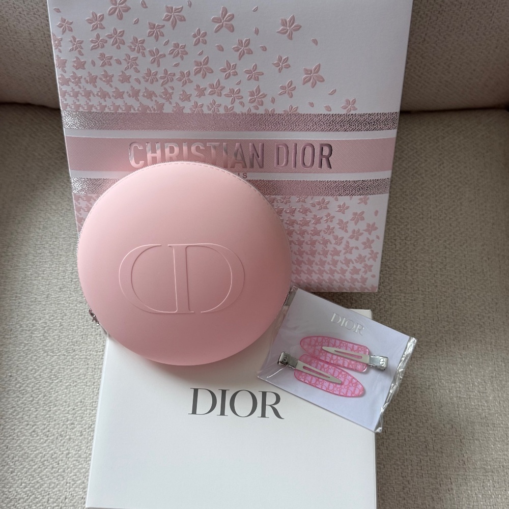 New Dior pink pouch with an Dior pouch and Dior pink hair clips